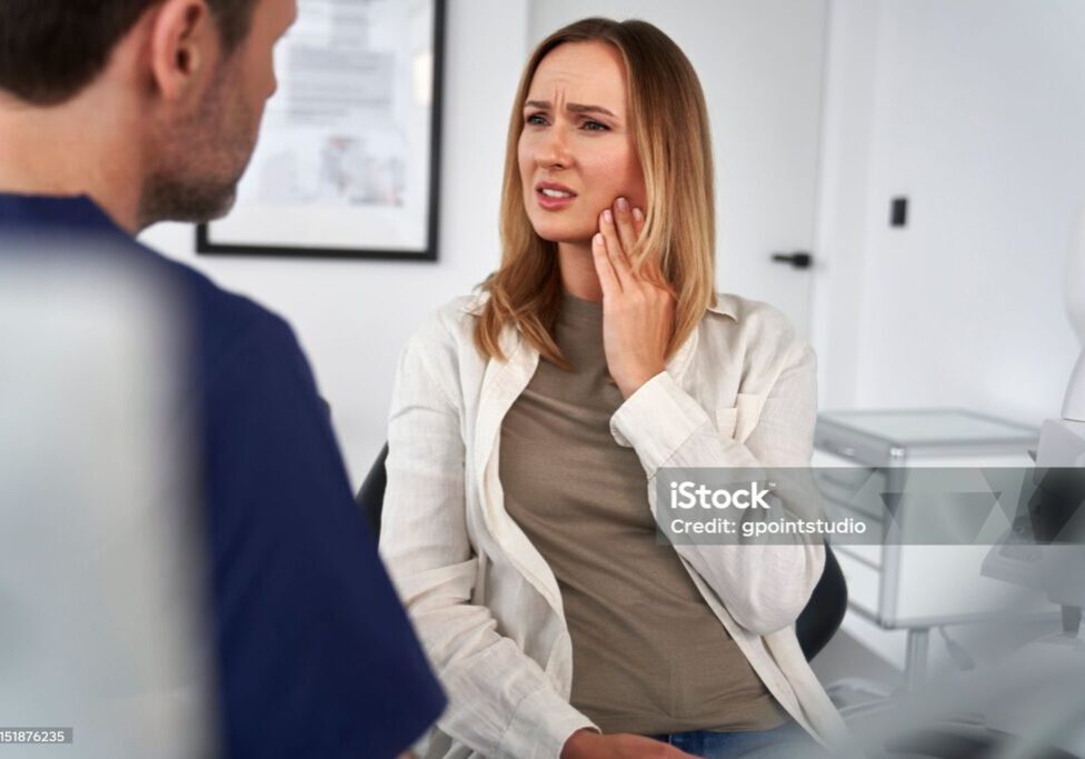 Female patient talking about the toothache